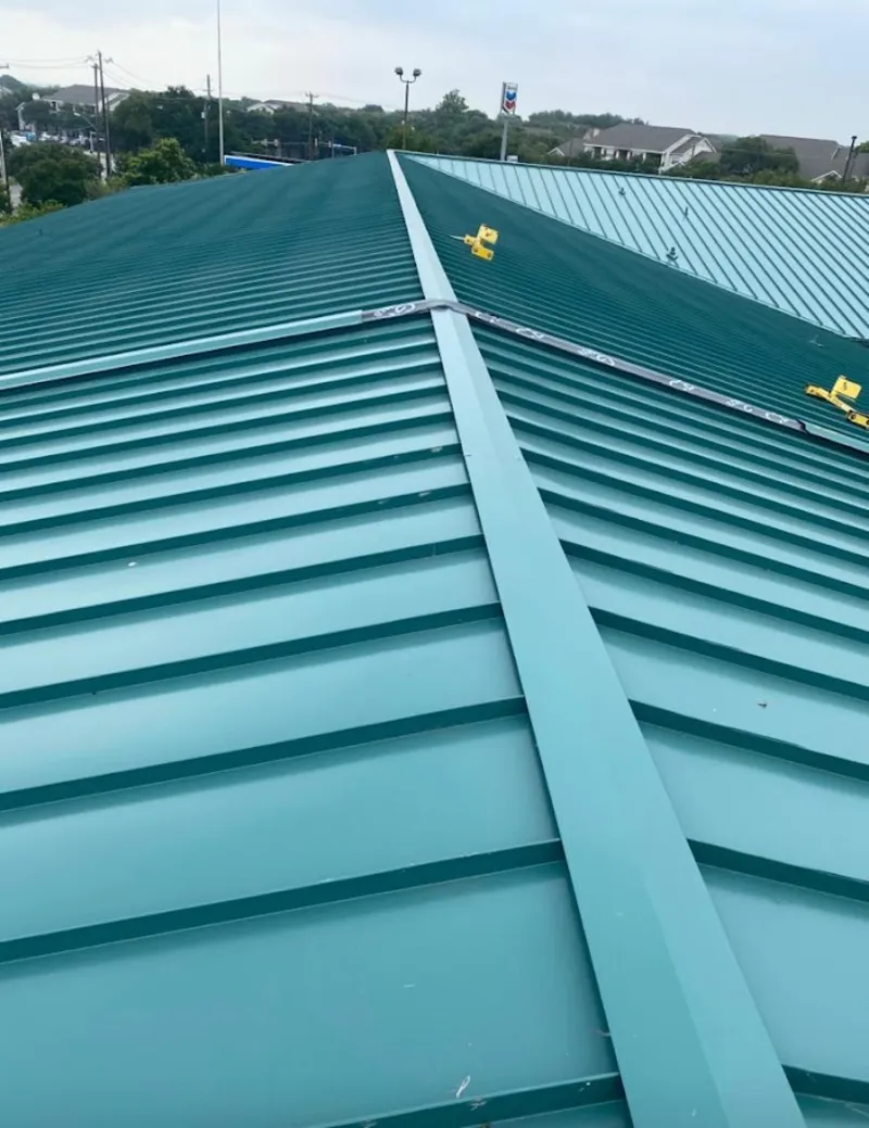 Green commercial metal roof ridge and valley for Metal Roof Repair in Kronenwetter
