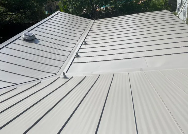 Solar attic fan installed on a metal roof for Roof Ventilation in Kronenwetter